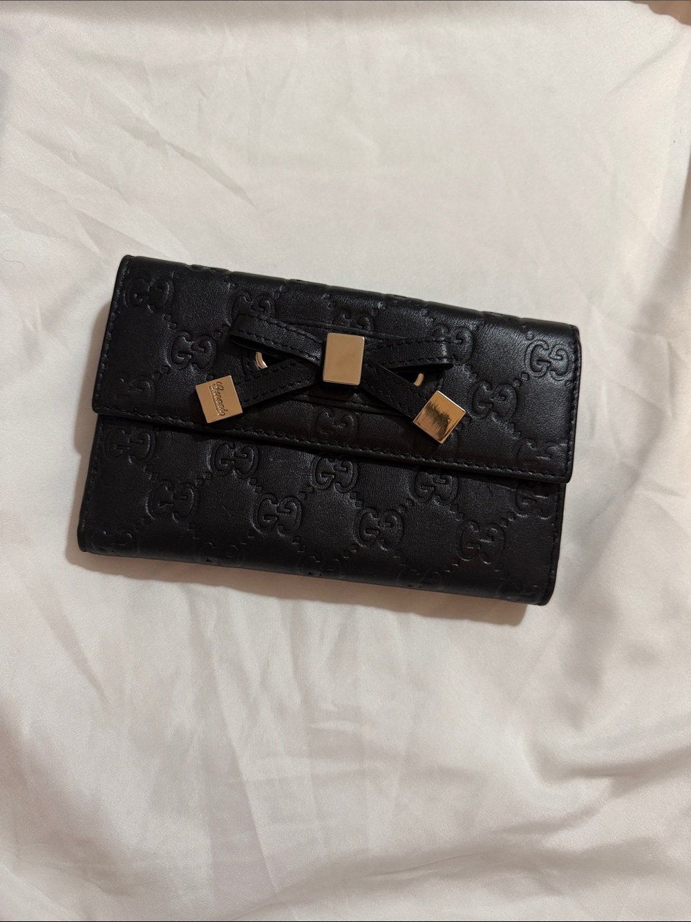 Gucci Guccissima Princy continental wallet with bow detail.